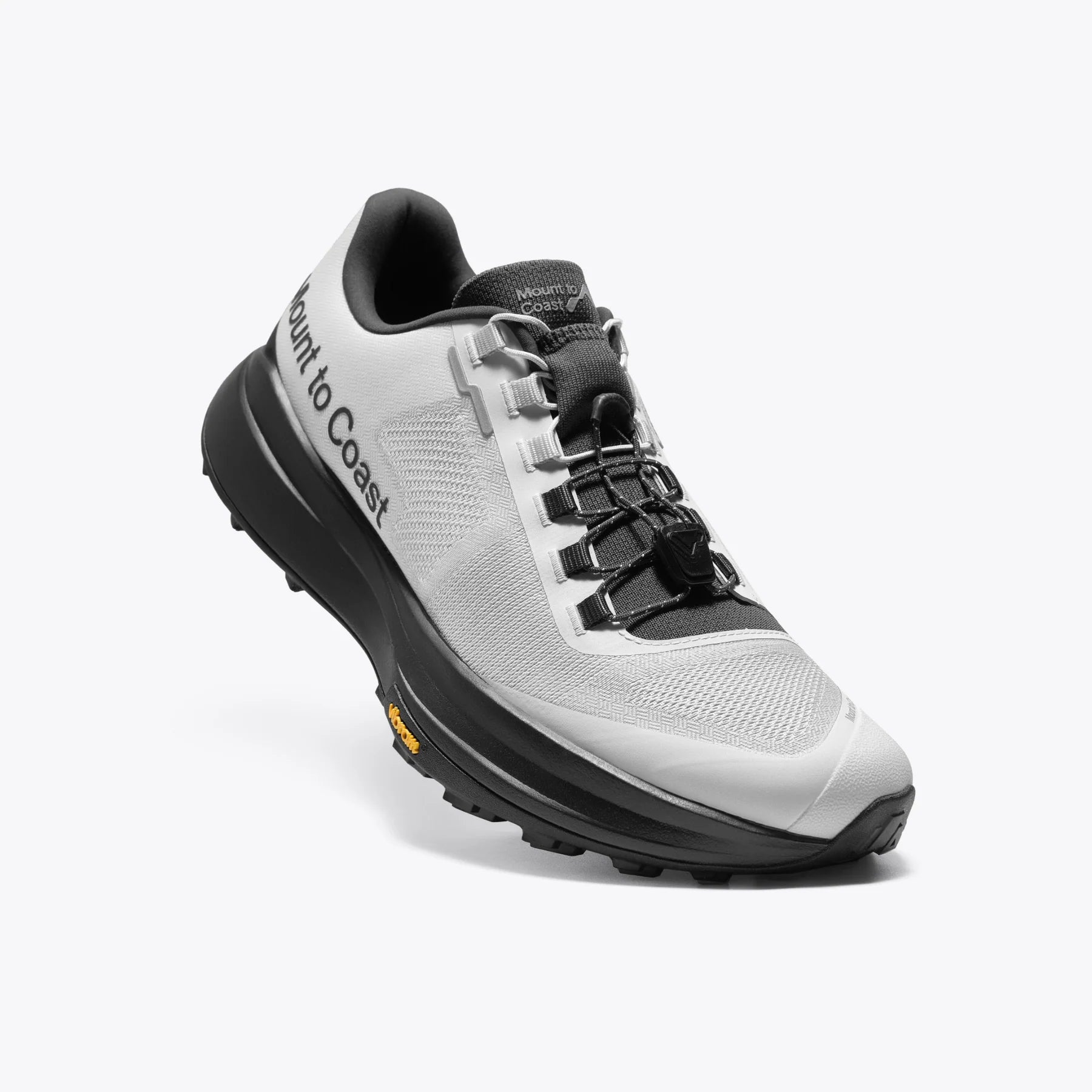 Mount to Coast T1 trail running shoe in white and black. Features Vibram outsole and brand name on the side.
#Color_tephra