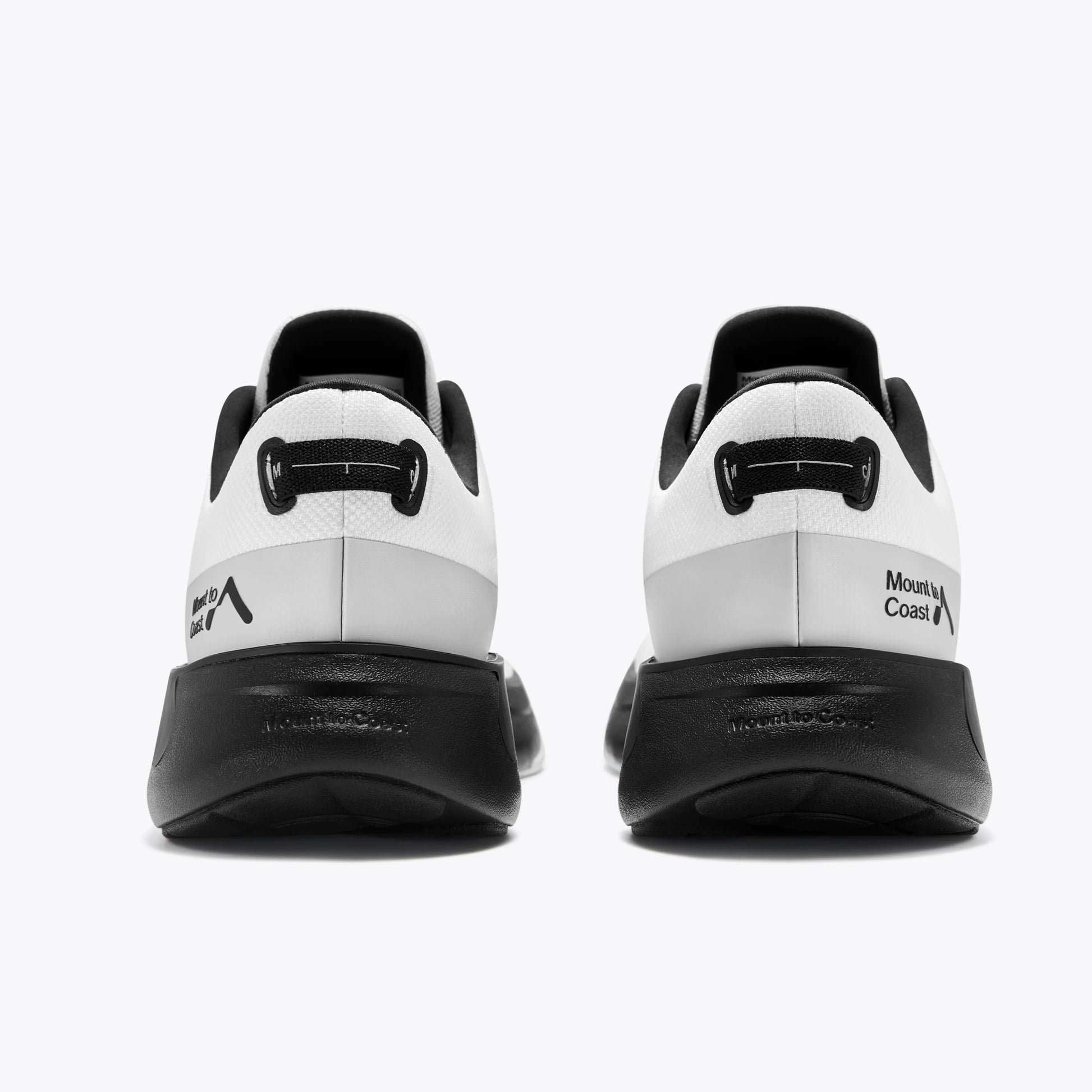 Mount to Coast S1 running shoe rear view in black and white, trail and road running footwear. #Color_white|black